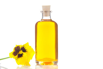 pansies essential oil in  beautiful bottle on  White background