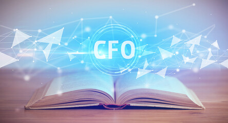 Open book with CFO abbreviation, modern technology concept