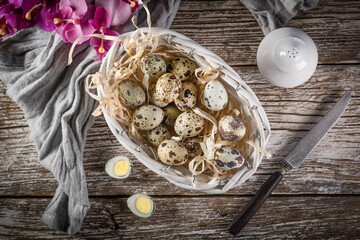 Quail eggs on a wooden table.
