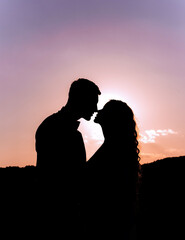 Silhouette of kissing couple
