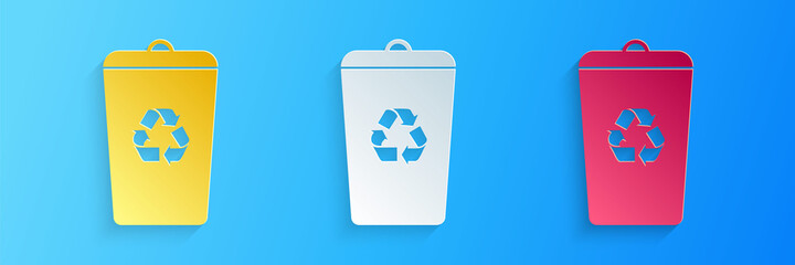 Paper cut Recycle bin with recycle symbol icon isolated on blue background. Trash can icon. Garbage bin sign. Recycle basket sign. Paper art style. Vector.
