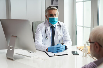 Protective masks and gloves are worn by all medical staff regardless