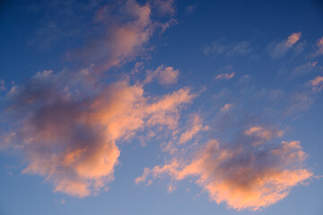Red clouds in the blue sky at sunset