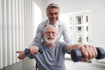 Physiatrist helping his patient rehabilatate from injury via exercising