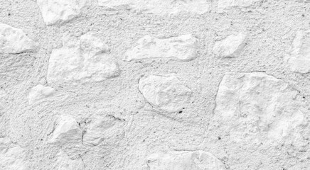 White texture of an old wall with some carved exposed stones - old vintage texture design - large image in high resolution