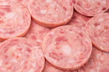 Boiled sausage isolated on white background. Slices.