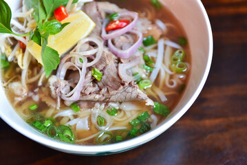 Fresh hot pho soup in a white bowl from traditional Vietnamese cuisine