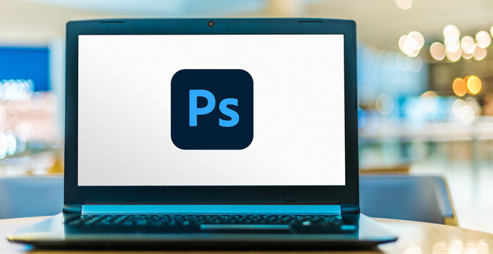 Laptop computer displaying logo of Adobe Photoshop Photos | Adobe Stock