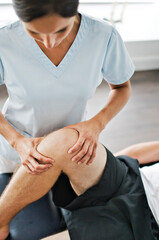 Fototapeta na wymiar physiotherapist doing treatment with patient in bright office with leg training