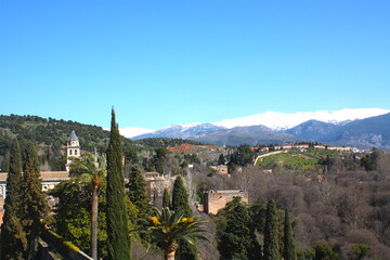 View of Granada city from Alhambra castle, with Sierra Nevada Mountain and the eternal snow, Granada, Andalusia, Spain. 