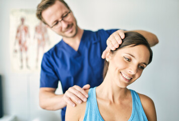 Male Physical Therapist Stretching a Female Patient nack