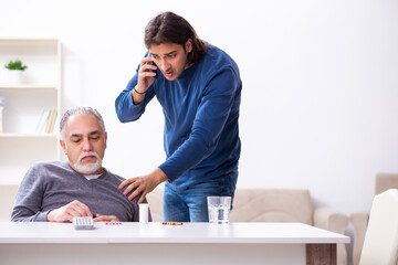 Grandfather and grandson in first aid concept