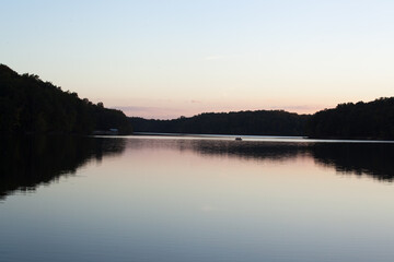Fototapeta premium Sunrise over a lake and reflecting it