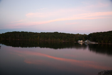 Fototapeta na wymiar Sunrise over a lake and reflecting it