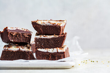 Raw vegan chocolate bars, copy space. Healthy sugar-free dessert.