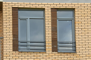 icon roof with new brown roofing tiles on residential property. banner on  roof for roofers....
