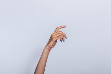 Female hand in gold paint
