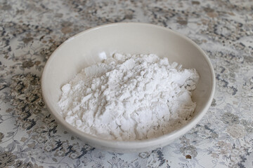 Raspberry curd pie recipe step by step. Corn starch, flour in a white bowl, plate. Ingredient for home baking