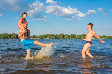 Family on vacation is having fun during the summer vacation. Games in the water, travel, rest, vacations.