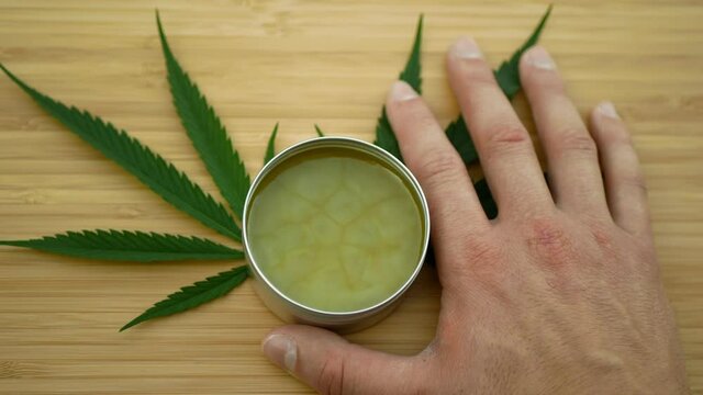 Cream cannabis hemp ointment lubricates on hand medicinal cannabidiol CBD leag leaves, body massage relaxed effect, relieves applying pain scrub, liniment relax, antibacterial soothing, THC marijuana