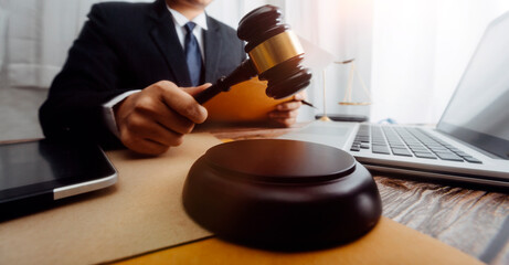 Business and lawyers discussing contract papers with brass scale on desk in office. Law, legal...