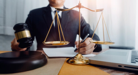 Business and lawyers discussing contract papers with brass scale on desk in office. Law, legal...