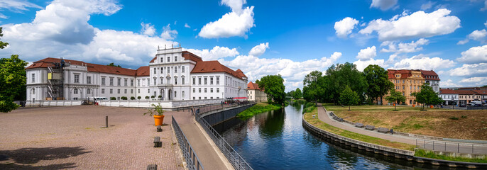 View of Oranienburg Castle with the banks of the river Havel in the foreground