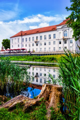View of Oranienburg Castle with the banks of the river Havel in the foreground