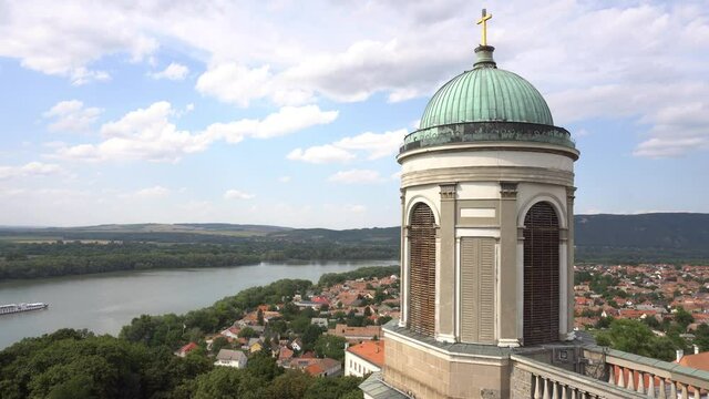 One Of The Towers Of Esztergom Cathedral With Danube River And Boat
