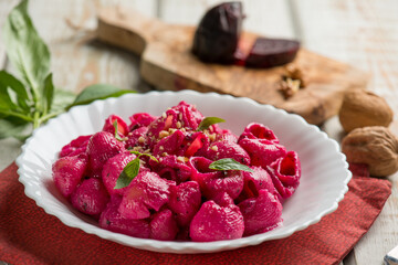 pasta with beet pesto nuts and basil