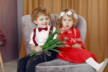Children with flowers. Gentelman with tulip. Mother's day. Valentines day.