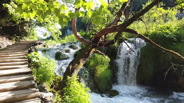 Majestic view on waterfall with turquoise water in the Plitvice Lakes National Park, Croatia. Europe. One of the oldest and largest national parks in Croatia. UNESCO World Heritage