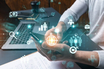 Man using phone. Hands typing smartphone. Double exposure with business icons hologram. Close up. Research and analysis concept. Investment.