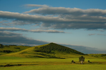 Russia. Republic Of Khakasia. Endless steppes among picturesque hilly mountains near the village of Shira.