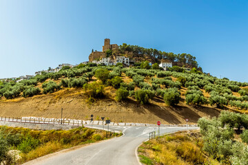 road junction beneath the hilltop fortress in the town of Montefrio, Spain in summertime