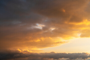 Fototapeta premium Beautiful bright sunset sky. Dramatic colorful clouds after sunset. Nature, sunset clouds backgrounds.