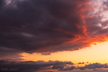 Fototapeta premium Beautiful bright sunset sky. Dramatic colorful clouds after sunset. Nature, sunset clouds backgrounds.