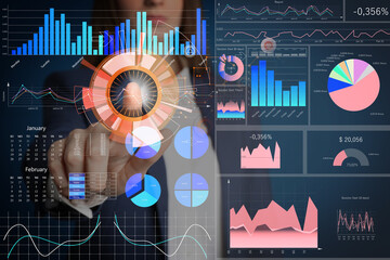 Young woman pointing at digital graphics, closeup. Modern technology