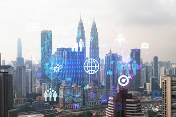 Naklejka na ściany i meble Social media icons hologram over panorama city view of Kuala Lumpur, Malaysia, Asia. The concept of people networking and connections. Double exposure.