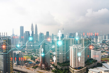 Social media icons hologram over panorama city view of Kuala Lumpur, Malaysia, Asia. The concept of people networking and connections. Double exposure.
