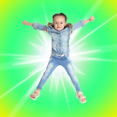 Cute little girl jumping on colorful background. School holidays