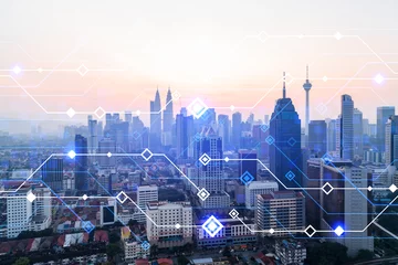 Fotobehang Glowing hologram of technological process, aerial panoramic cityscape of Kuala Lumpur at sunset. KL is the largest innovative hub of tech services in Malaysia, Asia. Multi exposure. © VideoFlow