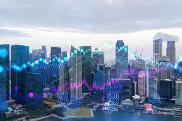 Forex and stock market chart hologram over panorama city view of Singapore, the financial center in Asia. The concept of international trading. Double exposure.