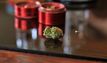nugget of weed with red grinder 