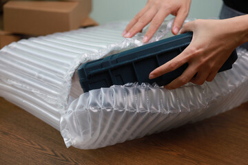 Packing products for delivery, shipping service. Translucent air packaging, protection of goods,...
