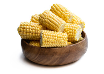 Raw corn cobs in wooden bowl isolated on white background