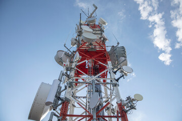clouds passing radio tower