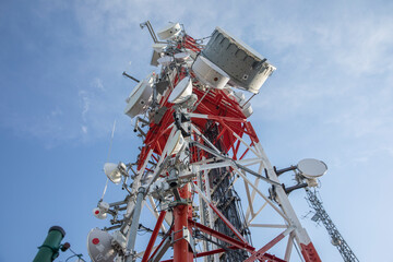 clouds passing radio tower