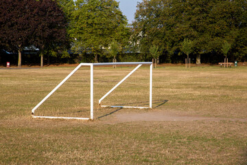 A five a side football or soccer goal post in a park or recreation area for the public to use