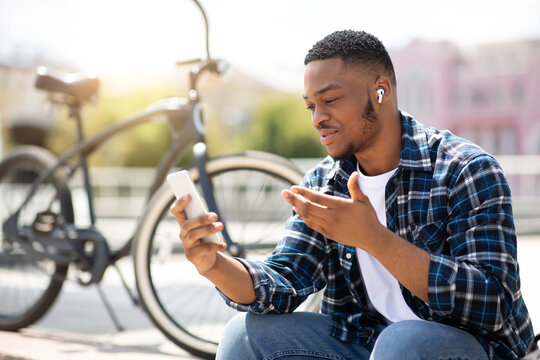 Portrait of african american guy making video call outdoor